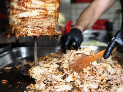 Close-up meat on special equipment, cook shawarma. Modern equipment for street trading. Opening successful shawarma. Electric shawarma machine. Business, production and sale shawarma
